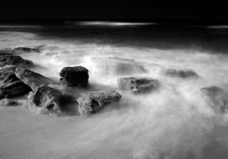 I had been told there were rocks on the beaches in North Eastern Florida that made the beaches look like the west coast of the United States. I found that hard to believe. Every beach I had seen in Florida was simply white sand. I decided to check out Washington Oaks and see for myself. 

Sure enough, the beach had wonderful configurations of rocks scattered around it. The scene took me back to what it was like when I lived in California, except the water is warmer! I had a wonderful time photographing.

📷 WASHINGTON OAKS 1 © 1989 | Washington Oaks Gardens State Park, Florida

This photograph is hand-printed in Clyde’s darkroom on fiber-based paper, selenium toned, then mounted and matted to current archival standards. The photograph is a limited edition and signed by Clyde.